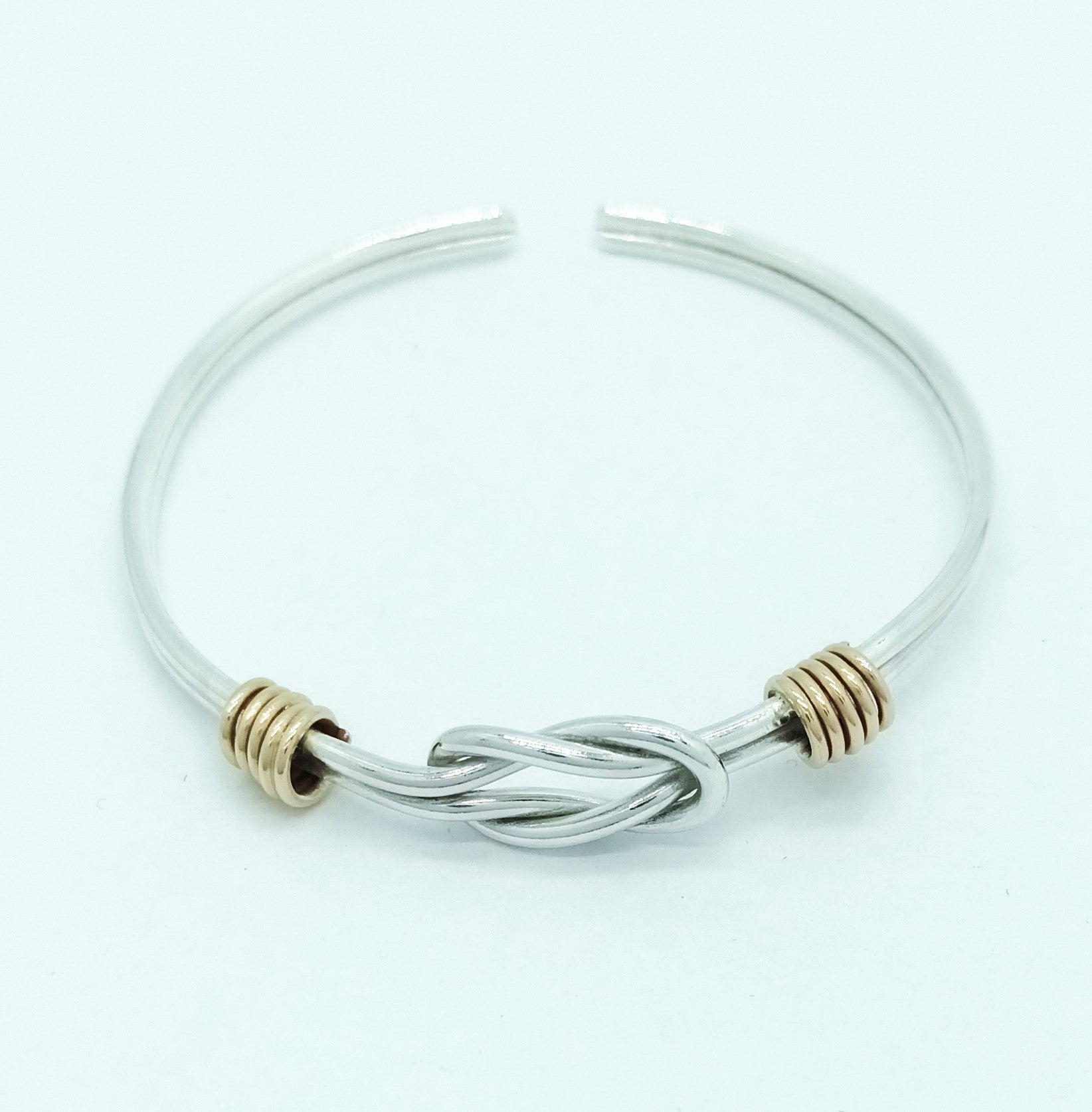 Silver Reef Knot Bangle with Gold Accents